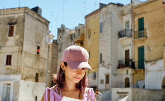 woman wearing pink fitted cap in city